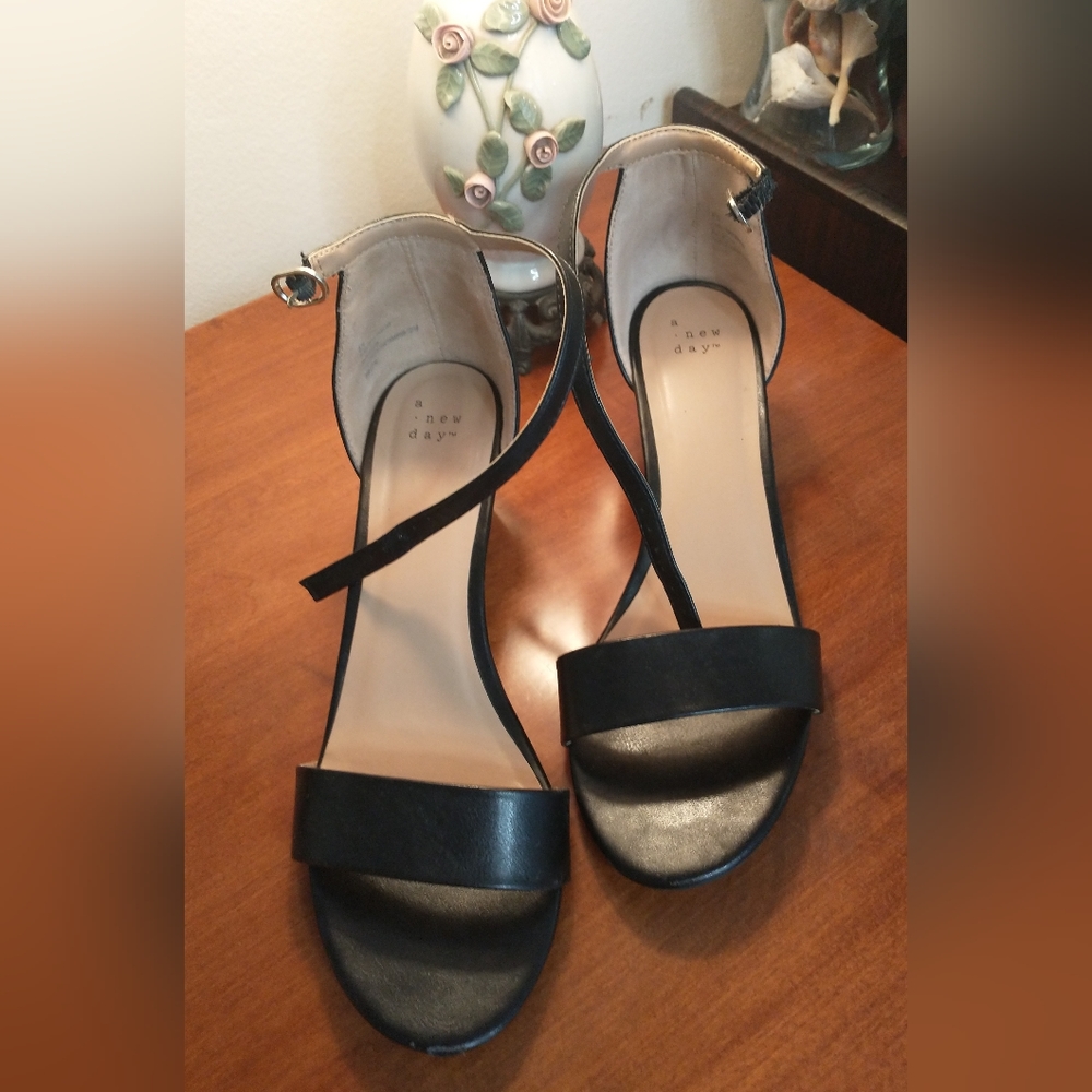 Black, low wedge, ankle strap shoes.